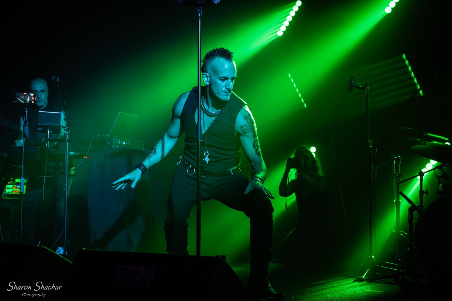 Olive Shows Depeche Mode tribute - vocalist under green stage light