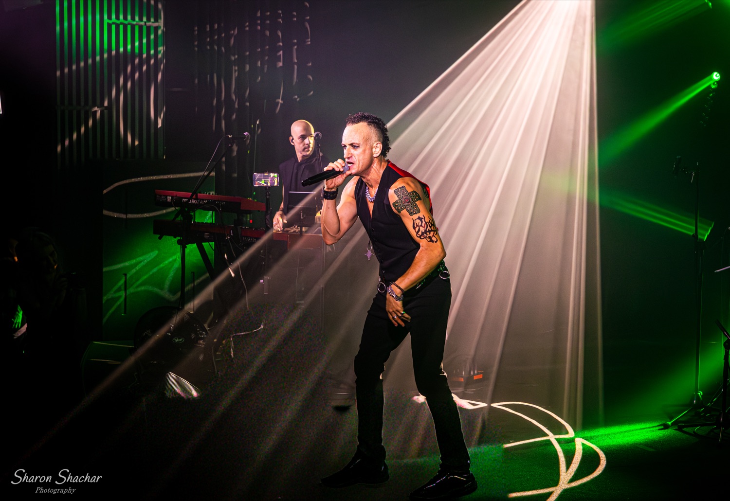 Olive Shows Depeche Mode tribute - vocalist singing in red light
